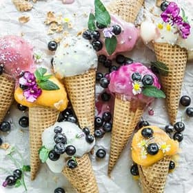 Coloured fruit icecreams with berries