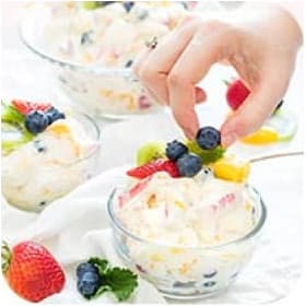 Hand picking berry from the icecream